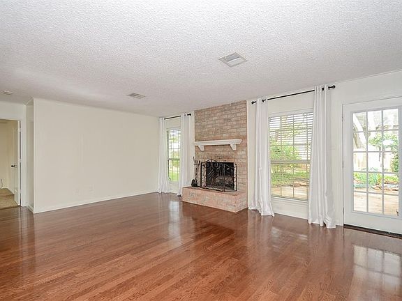 Gas log fireplace. Lots of natural light and great views of the back yard.
