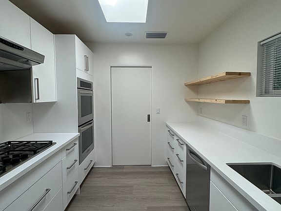 Kitchen with pocket door to Laundry room closed