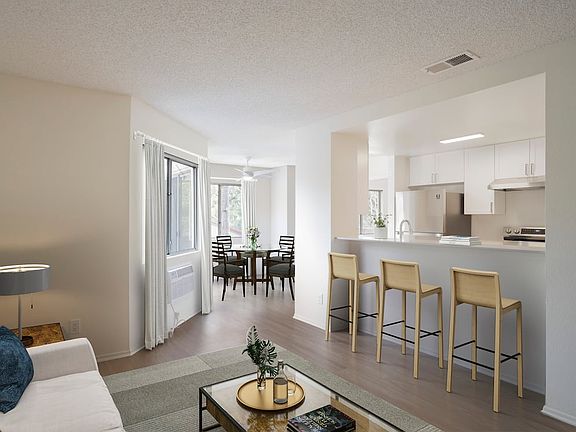 Renovated Package I living and dining room with hard surface flooring