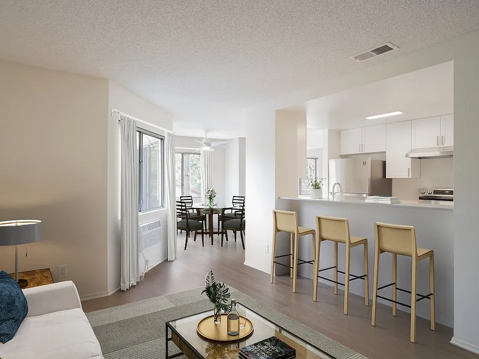 Renovated Package I living and dining room with hard surface flooring