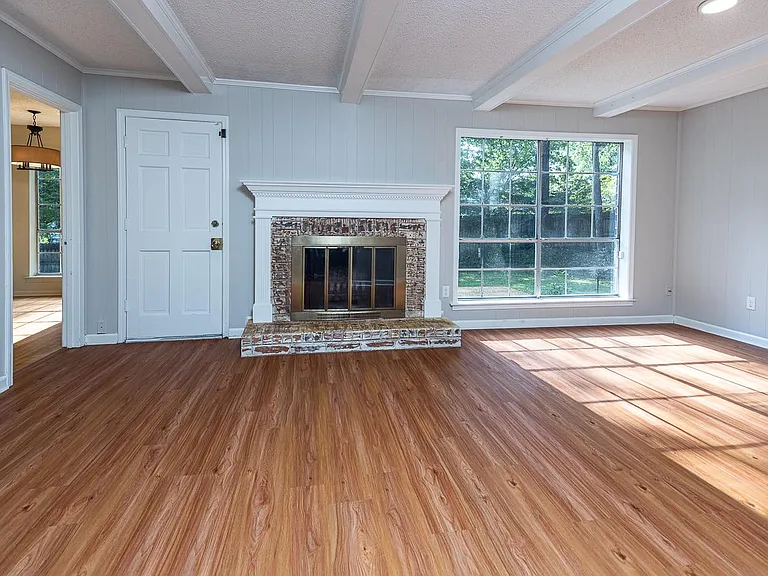 Family room with wood burning fireplace