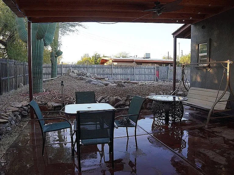 covered patio with pond