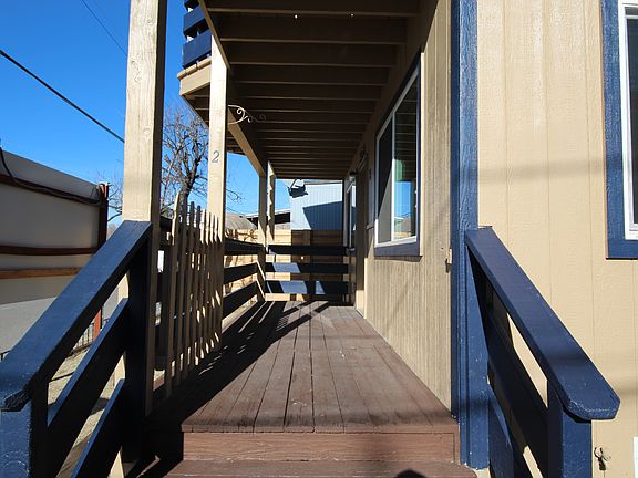 Balcony leading to front door.