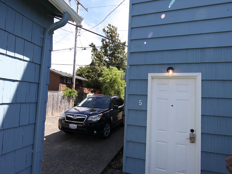 Unit 5 entrance and view of designated parking space