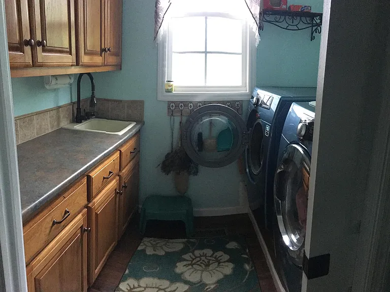 Spacious laundry room with sink