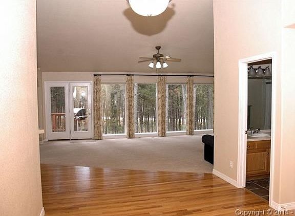 A large open entry foyer with study or home office to the right.