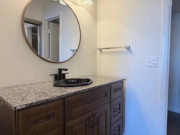 Primary Bath w/ upgraded vanity, vinyl plank floors & newly installed comfort height toilet.