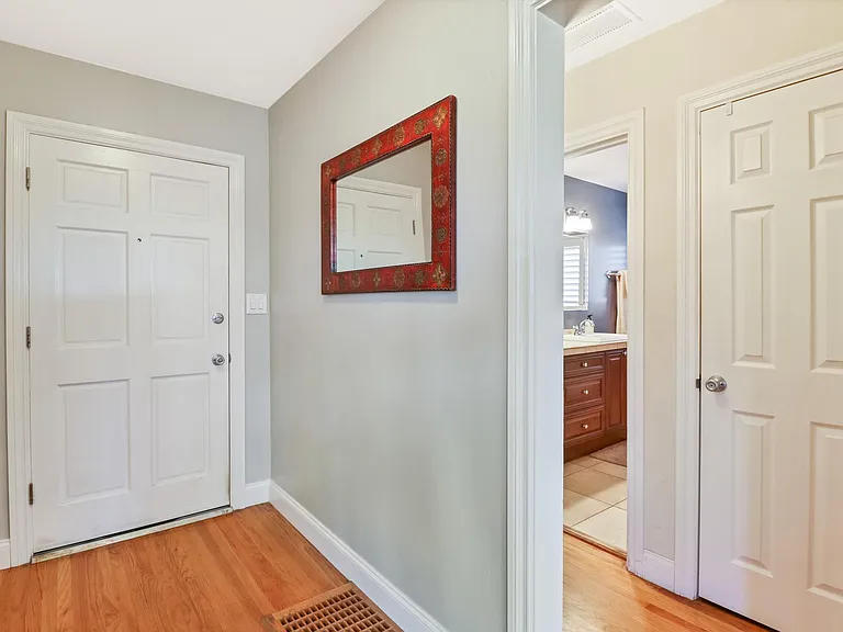 Front entryway, with main hallway on right (access to main bedroom, main bathroom, second bedroom, linen closet, and large utility closet that is great for storing vacuum, toiletries and and household cleaning supplies)