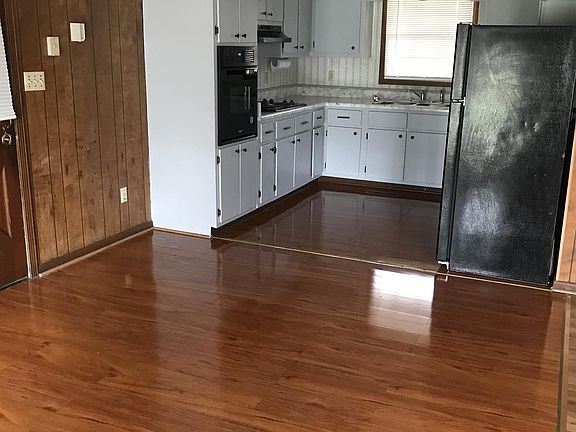 Dining area and kitchen from rear French doors