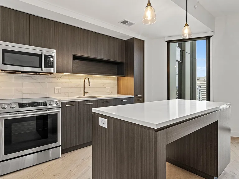 Large, functional kitchens with bar top island seating make the best your home space