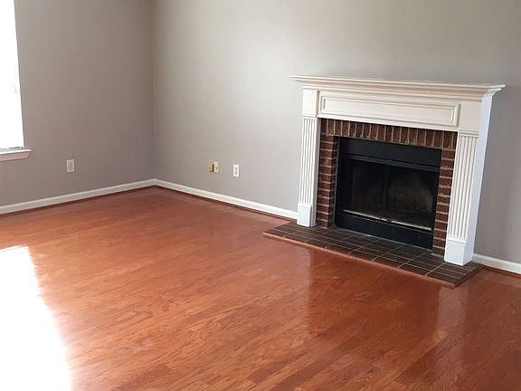 Living Room with Wood Burning Fireplace