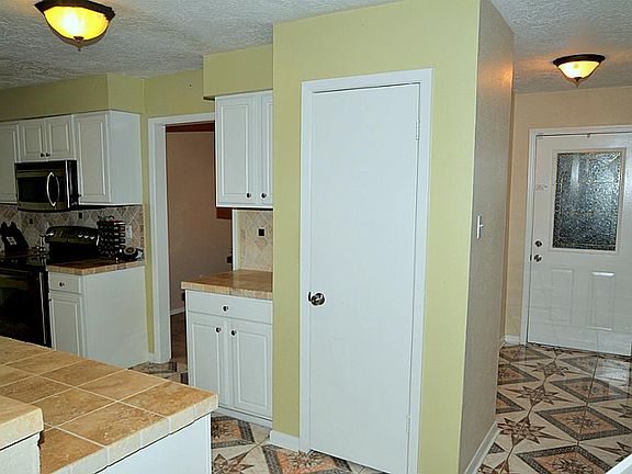 Entry views to Formal dining and kitchen.