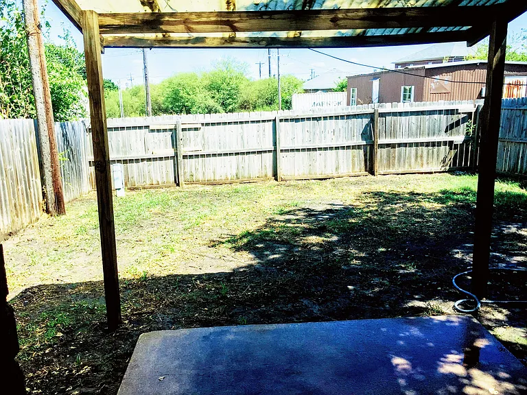 Both yards have covered awnngs and a privacy fence