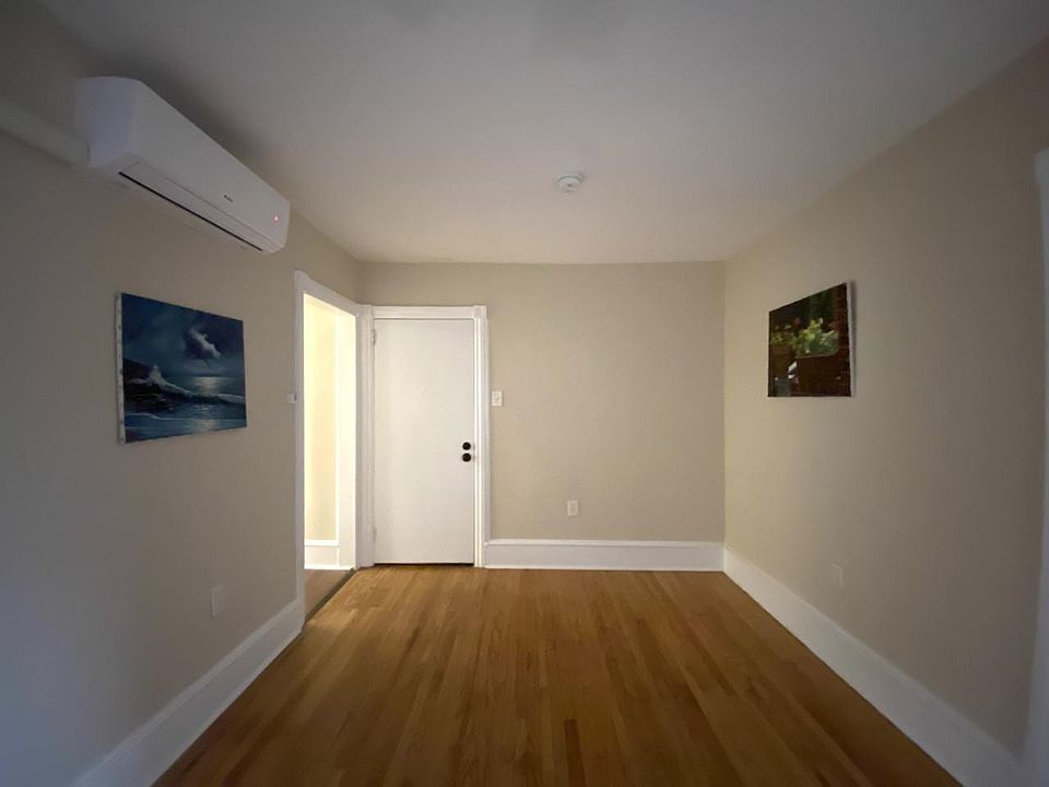 Living Room. The closed door is unit entrance.