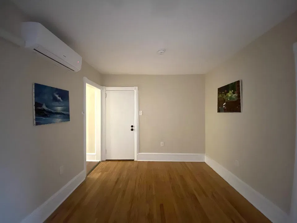 Living Room. The closed door is unit entrance.