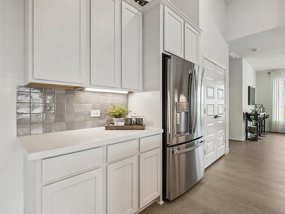 Impressive gourmet kitchen with custom cabinets