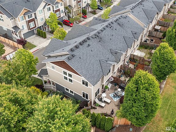 Home backs to an open green space and has a landscape buffer on the side as well.