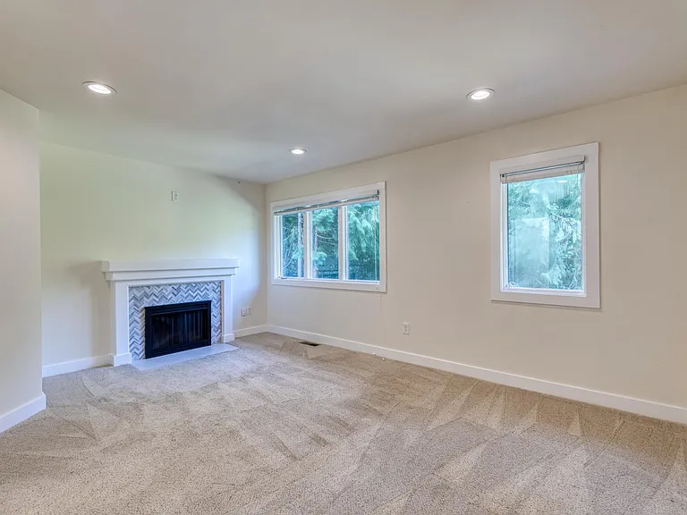 Primary Bedroom Upstairs with cozy fireplace and wiring for TV above