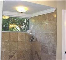 Upgraded large shower in master bath, with nice tile surround, crown molding and pretty light fixtur