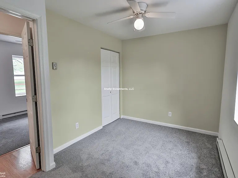 View of the second bedroom and primary bedroom