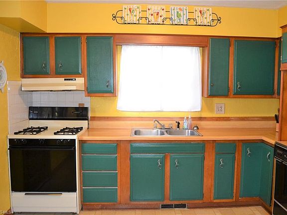 The kitchen has newer appliances. Exit to the upper deck and you can enjoy your morning coffee watching the sun rise.