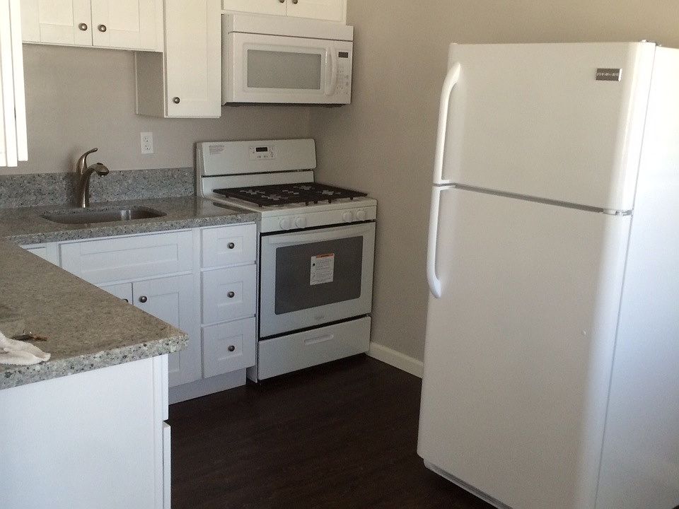 Kitchen with granite counters and new appliances