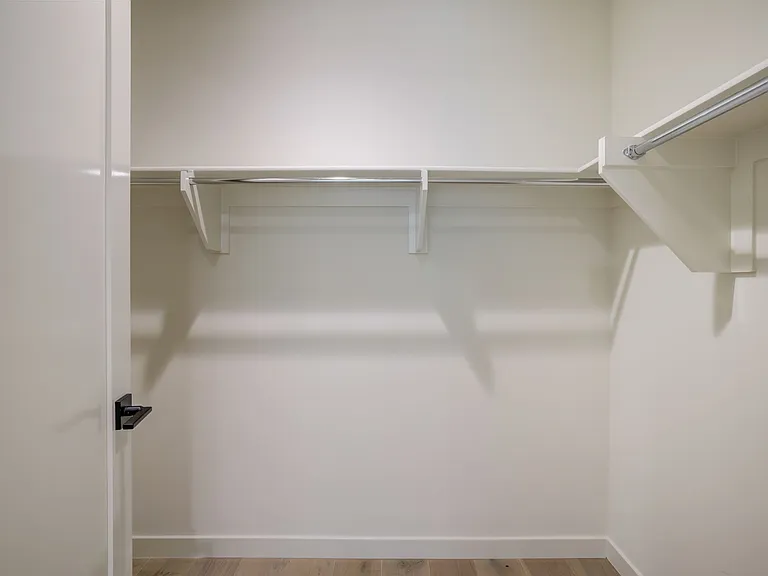 Private-entry guest suite featuring a walk-in closet.
