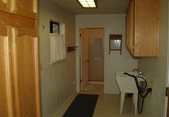 Laundry room with bathroom