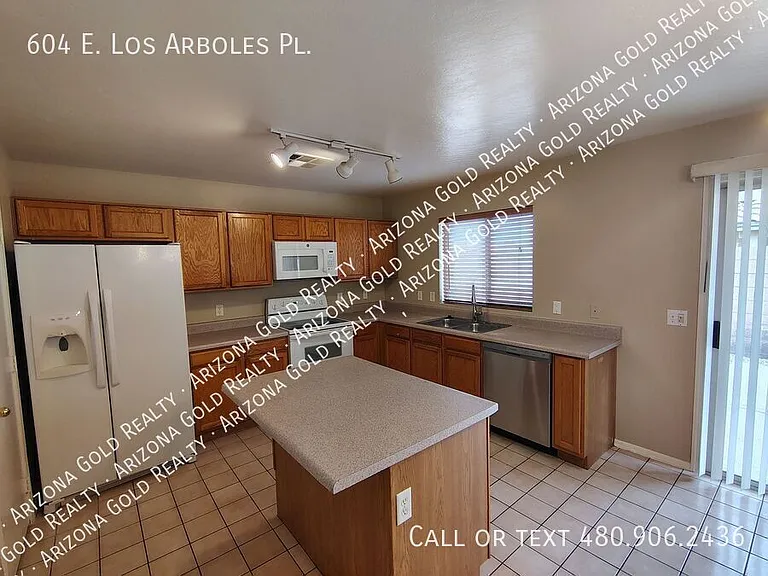 604 E Los Arboles Pl — Photo 8