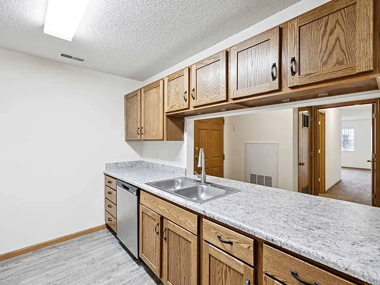 Our open-concept layouts make entertaining effortless, blending kitchen and living spaces for a warm, inviting atmosphere.