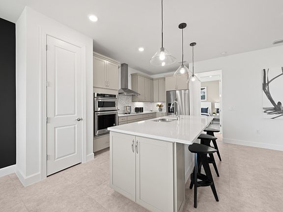 Kitchen with built-in stainless steel appliances