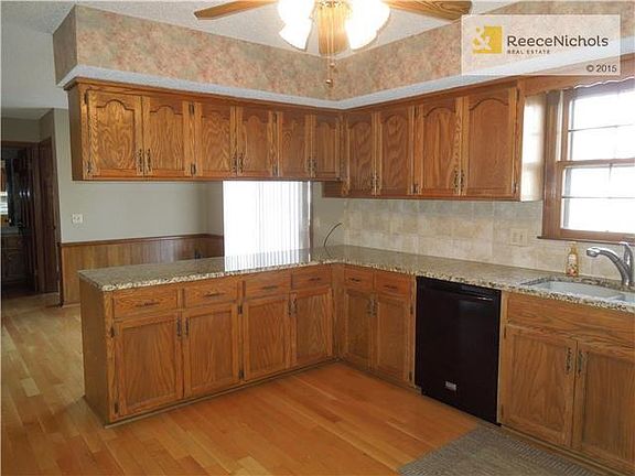 Tons of cabinet space with beautiful granite countertops.