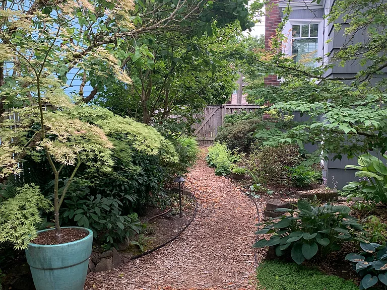 Wonderful garden path leads you to the street from the cottage.