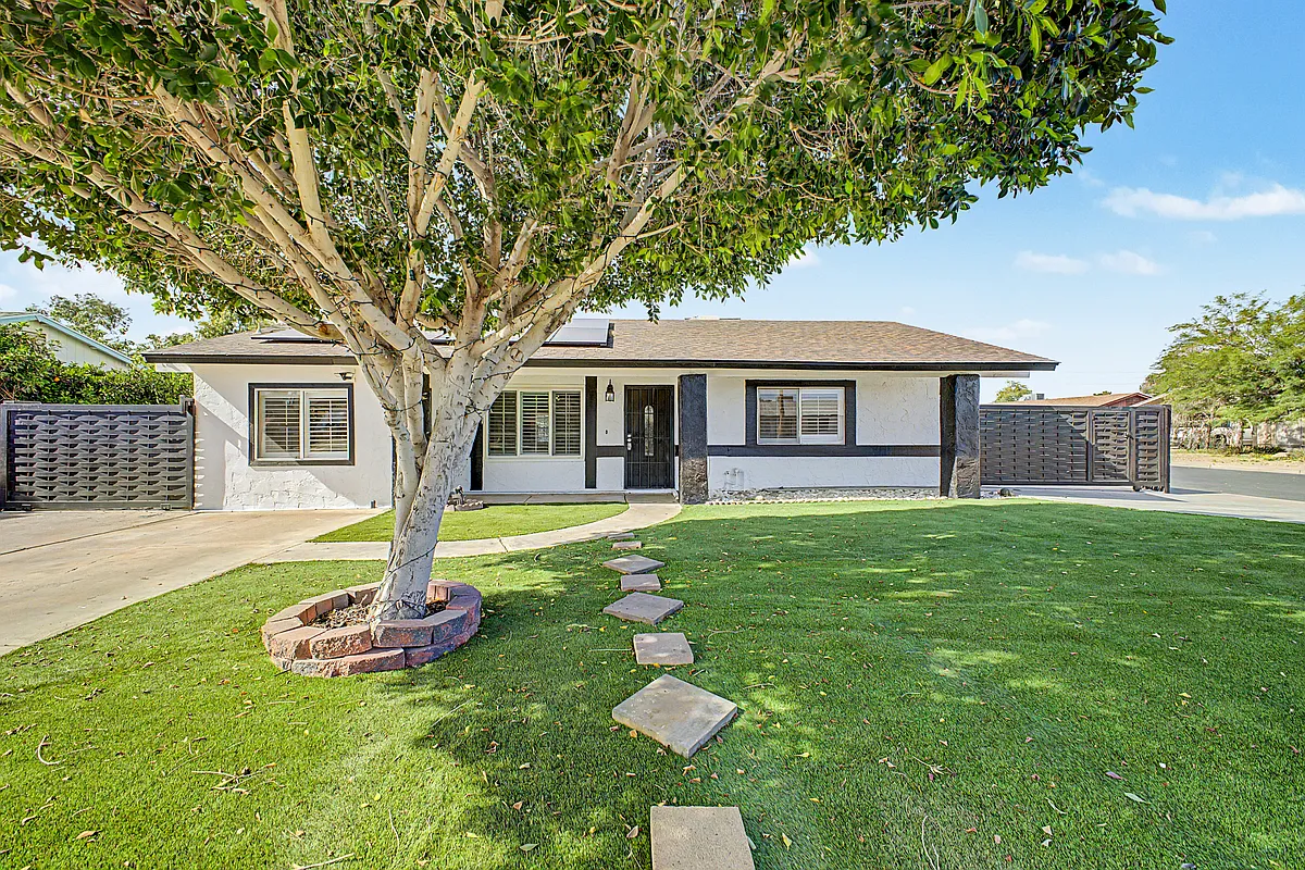 Front of home with low maintenance turf yard - 2550 E Butte St