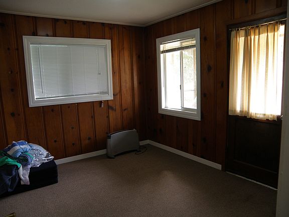 knotty pine paneling in bedroom