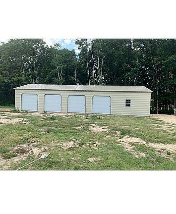 4 bay garage with shop.