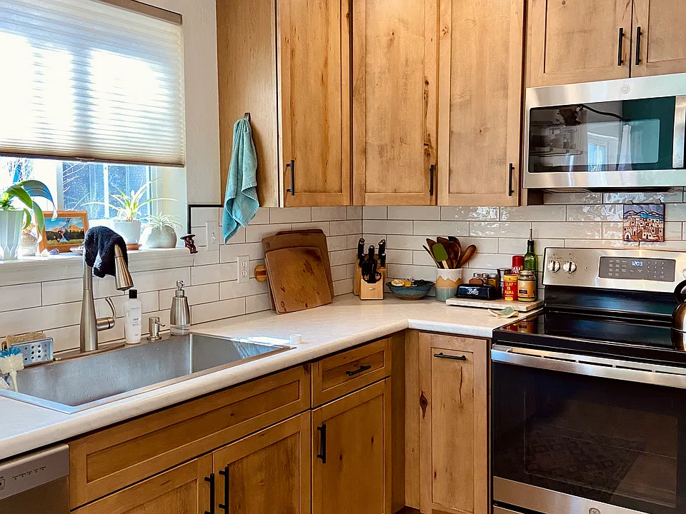 Large farm house sink and the electric oven has an air fry feature.