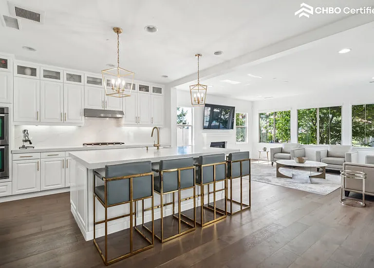 Fully Equipped Open Floor Plan Kitchen with Double Ovens