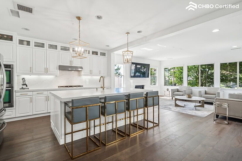 Fully Equipped Open Floor Plan Kitchen with Double Ovens