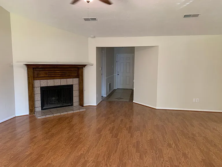 Family room view of entry way. Bedrooms are down the hall to the left
