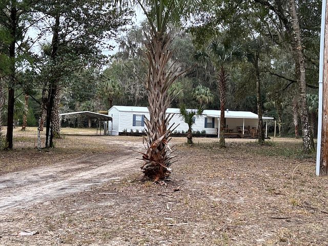 The home front view. Surrounded by beautiful trees.