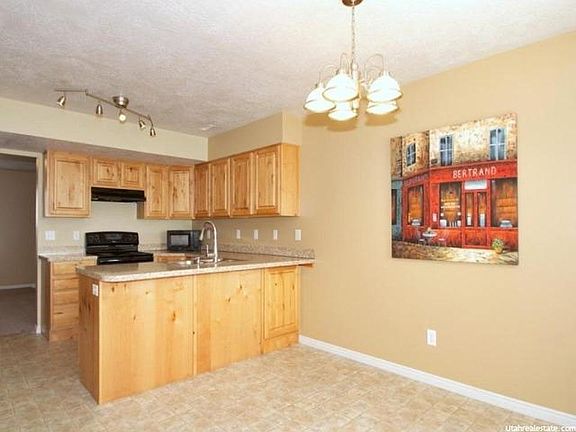 LARGE KITCHEN AND DINNING AREA