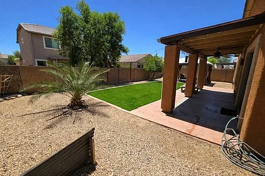 Backyard upgraded with new turf, rocks and shade sail (not pictured here) for additional shade.