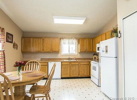 Spacious eat- in kitchen with plenty of counter and cabinet spac