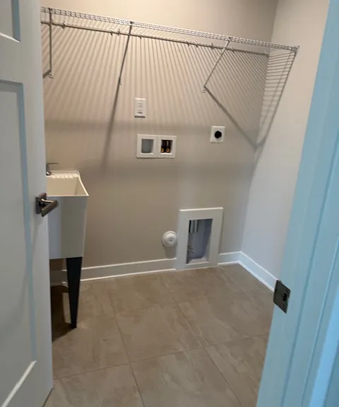 LAUNDRY AREA WITH SINK. 
OWNER WILL PROVIDE WASHER/DRYER