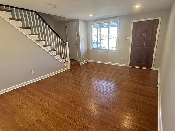 Living room with stairs to second floor