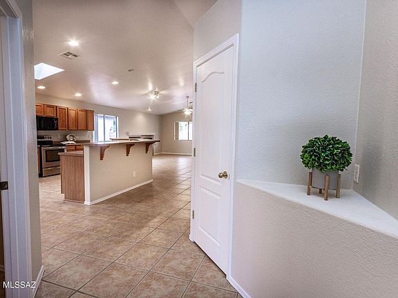 Front Entry with laundry room to the left and hall closet to the right