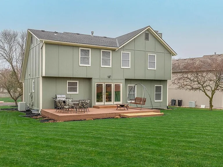 The deck is right outside the kitchen for easy entertaining outdoors, too!