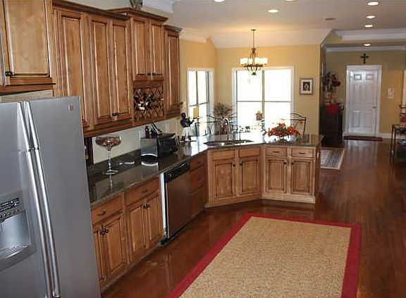 Stainless appliances. Refrigerator remains with the house.