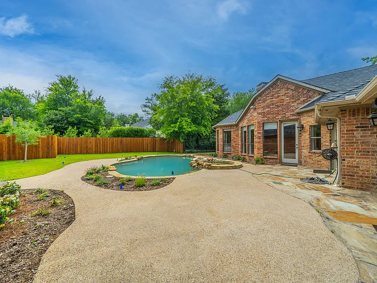 Poolside Serenity: Relax on the Sun-Drenched Patio with Garden Views